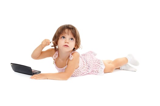 small girl with paint and mirror isolated on white