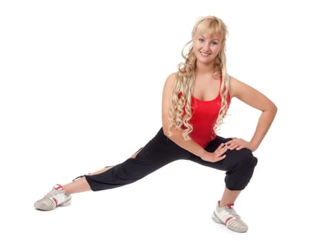 Beautiful girl is engaged in fitness, demonstrates the flexibility of the body isolated on white background