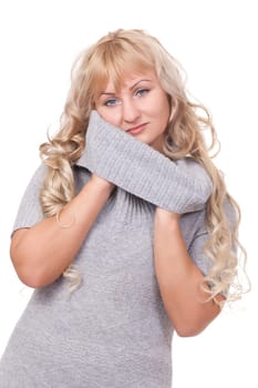 Beautiful winter fashion girl playing with her turtleneck sweater.Isolate on white