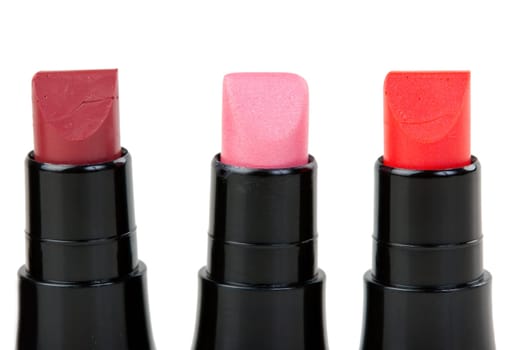 Three lipstick set in a row, isolated on white background