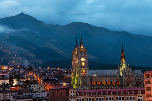 Night time view of the basilica and old town in Quito, Ecuador