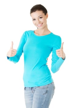 Beautiful young woman in casual clothes gesturing thumbs up.