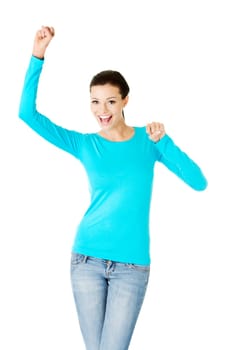 Excited happy success young woman with fists up, isolated