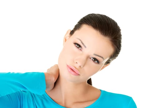 Young woman holding hand on her neck. Neck pain concept