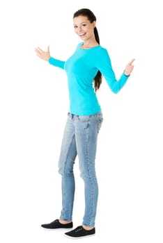Happy , excited young woman presenting copy space on her palm, isolated on white