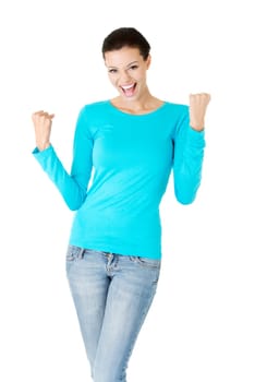 Excited happy success young woman with fists up, isolated