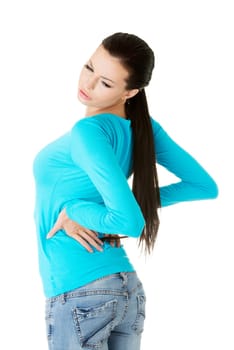 Young woman with backache, isolated on white