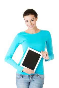 Young pretty woman working on tablet computer, isolated on white