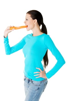 Fit young beautiful woman with carrot, isolated on white