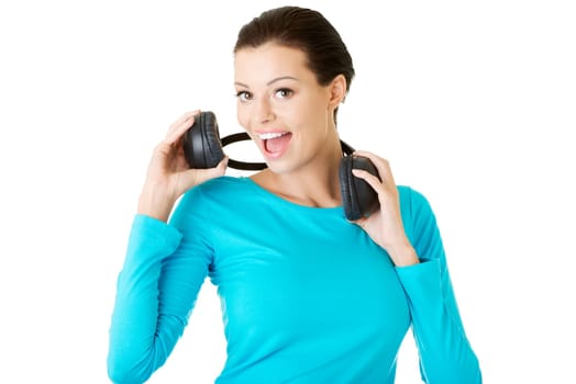 Beautiful woman with headphones, she is listen to the music