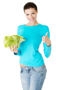 Portrait of attractive caucasian smiling woman with salat gesturing thumbs up, isolated on white