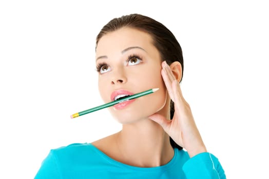 Thoughtful woman with pencil, isolated on white