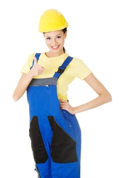Female construction worker gesturing thumbs up, isolated on white