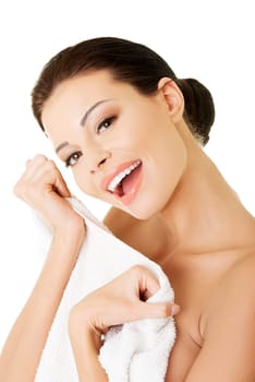 Beautiful happy woman after bath or spa, holding towel