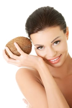 Beautiful woman with coconut in hands over white background