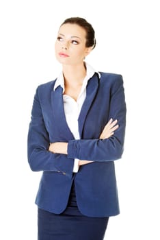 Young thoughtful businesswoman looking on side, isolated on white