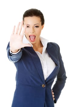 Serious business woman making stop sign over white