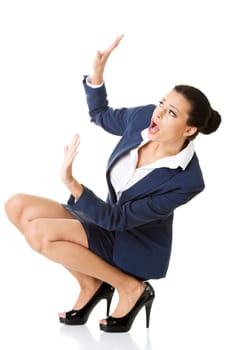 Scared businesswoman defending herself, isolated on white background