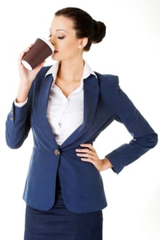 Cofee brake in rush day. Business woman drinking cofee or tea from paper cup.