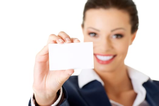 Beautiful smiling businesswoman with businesscard. Isolated on white