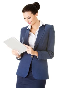 Business woman holding tablet computer with touchpad. Isolated on white.