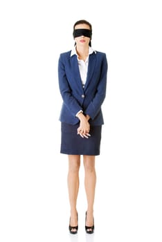 Portrait of a beautiful young blindfold businesswoman, isolated on white
