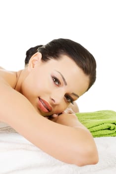 Beauty young woman relaxing in spa. Isolated on white.