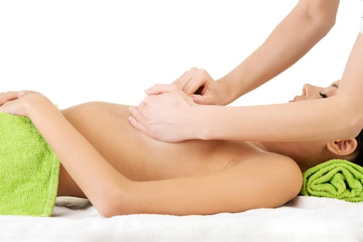 Beauty young woman relaxing in spa. Breast massage.