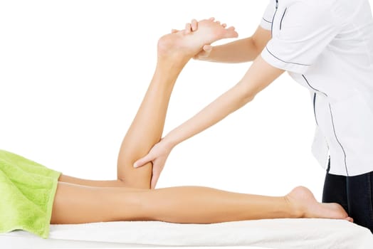 Physio therapist trying to fix the legs over white background