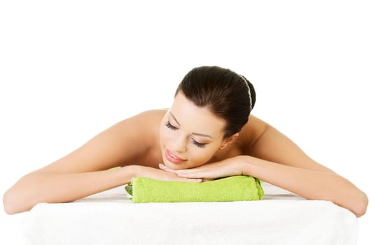 Beauty young woman relaxing in spa. Isolated on white.