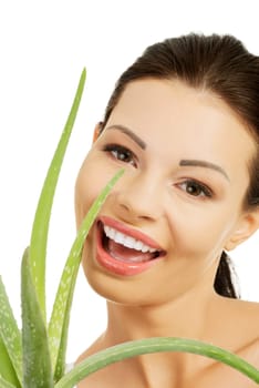 Young beautiful woman's face and aloe vera. Isolated on white background