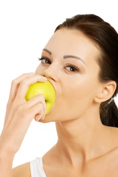 Beautiful woman with clean fresh healthy skin holding green apple. Isolated on white