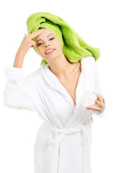 Attractive fit woman with moisturizer cream. Isolated on white background
