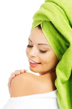 Beautiful woman with a towel on her head, isolated on white