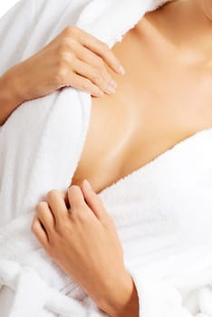 Close up on woman breast after bath. She is wearing bathrobe.