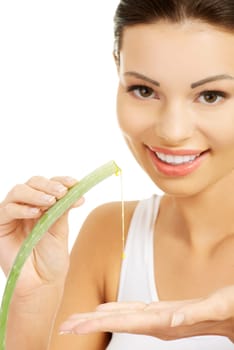 Young beautiful woman's face and aloe vera. Isolated on white background