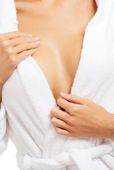Close up on woman breast after bath. She is wearing bathrobe.