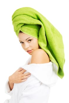 Beautiful woman with a towel on her head, isolated on white