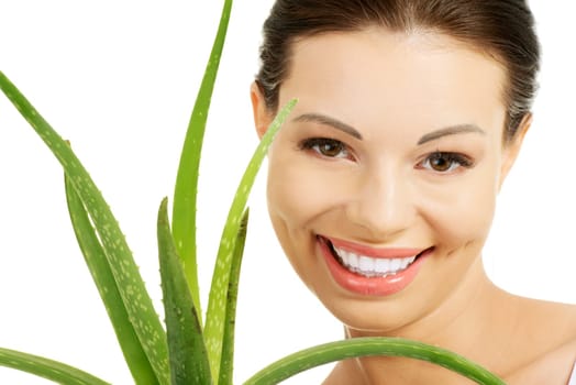 Young beautiful woman's face and aloe vera. Isolated on white background