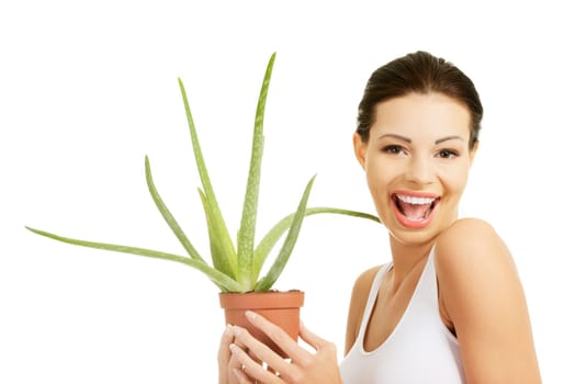 Young beautiful woman's face and aloe vera. Isolated on white background