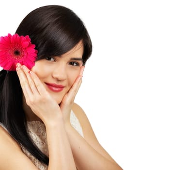Portrait of a beautiful young woman with a flower in her hair isolated on white.