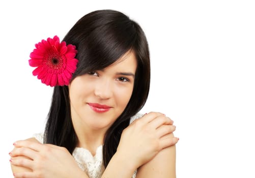Portrait of a beautiful young woman with a flower in her hair isolated on white.