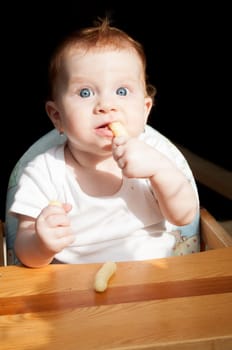 Cute Toddler Baby Girl Eating Corn Nibbles