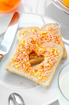 Closeup of a tasty and elegant breakfast made of bread and candies