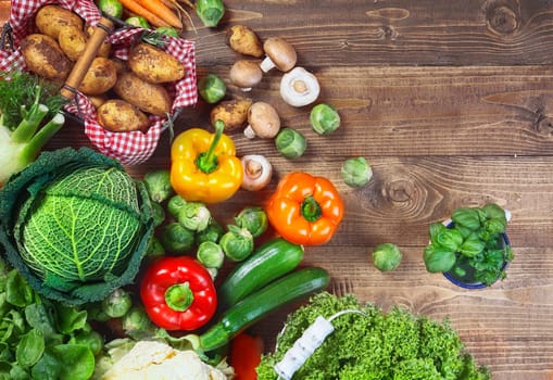 A variety of garden fresh vegetables on wooden table