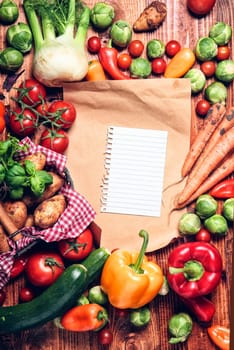 Garden fresh vegetables and blank and white brown paper