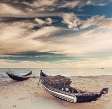 Sunrise. Old fisherman boats on the foreground