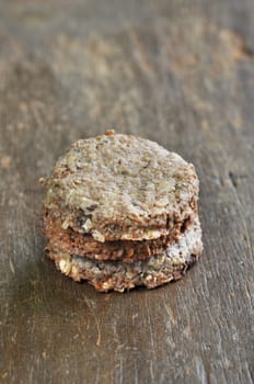 Stacked of cookies on brown old wood