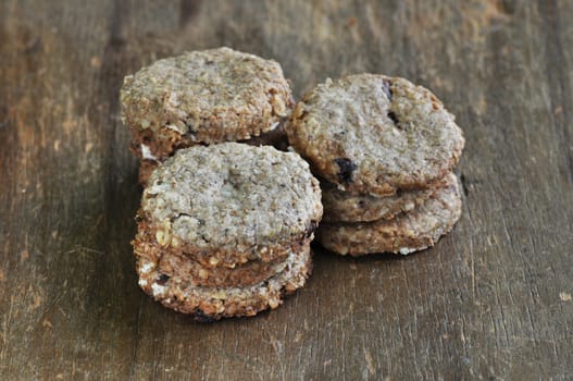 Stacked of cookies on brown old wood