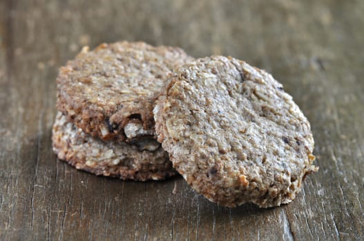 Stacked of cookies on brown old wood